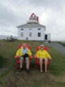 Pete and June sit in front of the old lighthouse